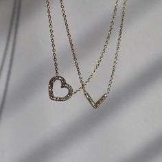 This elegant necklace features an open heart design, studded with CZ stones for a touch of sparkle. Perfect for adding a touch of love and glamour to any outfit. -stainless steel, gold plated -15.5" in length with 2" extender Elegant Heart-shaped Gold-tone Chain Necklace, Luxury Heart-shaped Gold Plated Chain Necklace, Luxury Heart-shaped Necklace With Adjustable Chain, Valentine's Day Heart-shaped Diamond Necklace With Accents, Gold Heart-shaped Chain Necklace For Valentine's Day, Open Heart, Timeless Accessories, Elegant Necklaces, Cz Stone