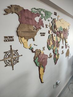 a world map is mounted on the wall