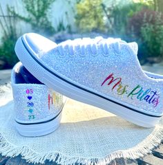 Hand Glittered unbranded canvas sneakers glittered in a gorgeous chunky white mix called *bungalow* with rainbow glitter personalization of your choice.  Matching glittered trim also available in place of black strip.  See options at checkout. Personalization is added in rainbow glitter writing to include name on the outside of each sneaker and date down the back as shown. Please include custom info in the order notes. Should you desire different placement or options, please send us a message. G Sneakers For Wedding, Sparkle Sneakers, Bride Sneakers, Bridal Parties Colors, Fun Wedding Shoes, Bridal Shoe, Love Wins, Glitter Sneakers, Glitter Wedding