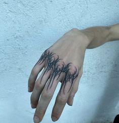 a person's hand with black ink on it