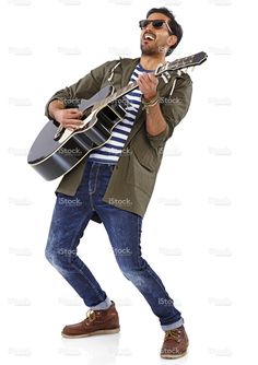 a man holding an acoustic guitar while standing in front of a white background stock photo