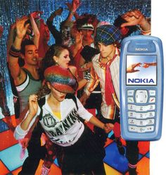 a group of people standing around each other in front of a nokia cell phone