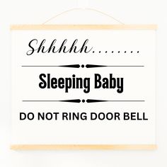 a sign that says sleeping baby do not ring door bell