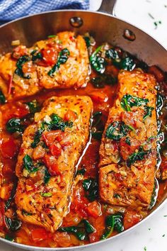 some food is cooking in a pan on the stove top and ready to be eaten