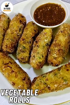 vegetable rolls on a plate with dipping sauce