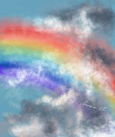 a multicolored rainbow in the sky with clouds