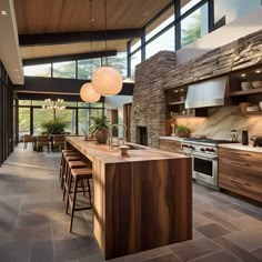 a large kitchen with wooden cabinets and counter tops next to an open floorplan