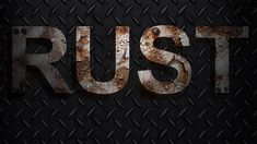 the word rust written in rusty metal on a black background