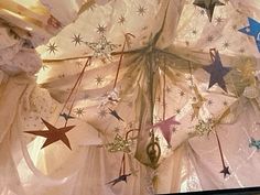 the ceiling is decorated with stars and ribbons