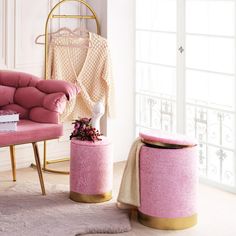 a pink chair and foot stool in a room with a white rug on the floor