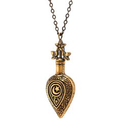 a gold necklace with an ornate design on the front and back of it, hanging from a chain