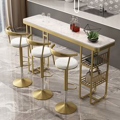 a kitchen with marble counter tops and pink stools