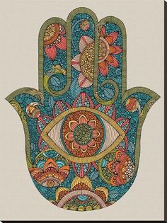 a hamsa with an ornate design on it's palm, and colorful flowers