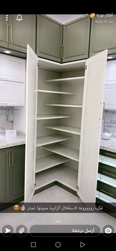 an open cabinet in the middle of a kitchen