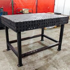 an industrial table is being constructed in a warehouse