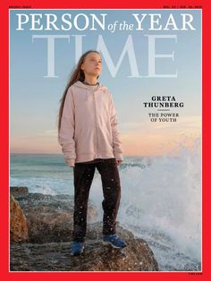 a person standing on top of a rock next to the ocean in front of a magazine cover