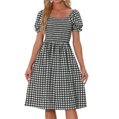 This Women's Smocked Dress combines the classic gingham plaid pattern with an on-trend square neckline, creating a stylish look that is perfect for casual outings or summer events. The smocked bodice of this dress provides a comfortable and stretchy fit, while the flowy skirt adds a flattering touch. It's designed to enhance your natural curves and provide all-day comfort. Cheap Plaid Gingham Dress With Ruffles, Short Black Gingham Dress, Tiered Dresses, Midi Short Sleeve Dress, Smocked Dress, Gingham Dress, Flowy Skirt, Mini Wrap Dress, Plaid Dress