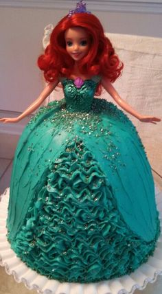 a cake that looks like ariel from the little mermaid movie is on sale for $ 4 99