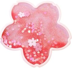 a pink and white flower shaped object with stars on it's back side,