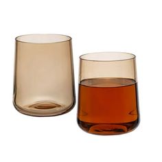 two glasses are sitting next to each other