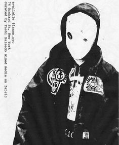 a black and white photo of a person wearing a hoodie with an evil cross on it