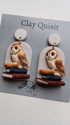 an owl is sitting on top of some books