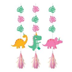 three dinosaur mobiles hanging from the ceiling with tassels and leaves on them