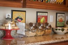 there are many different items on the counter in this kitchen, including cookies and muffins