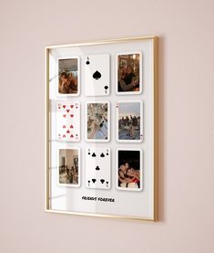 a frame with playing cards hanging on the wall