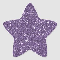 a purple glitter star on a white background