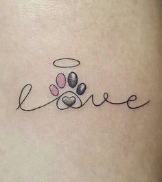 a dog's paw with the word love written in cursive writing