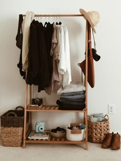 a clothes rack with shoes and hats on it