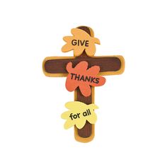 a wooden cross with the words give thanks for all