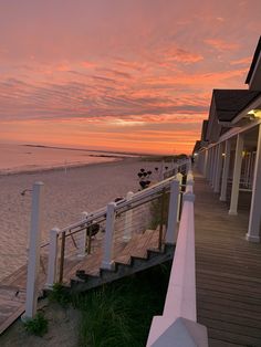 the sun is setting at the beach house