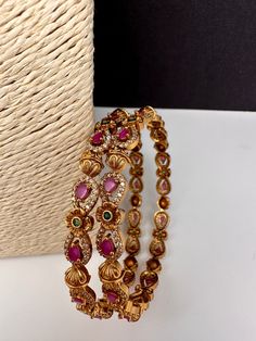 Traditional Bangles comes as a pairColor : Matte Size : Size : 2.4Stones : AD Red Green Stone Stone Bangles Gold, Green Bangles, Antique Necklace Victorian, Traditional Bangles, Stone Bangles, Lehenga Red, Bangles Gold, Real Pearl Necklace, Matte Size