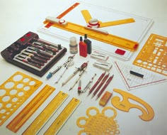 the tools are laid out on the table to be used for making paper art work