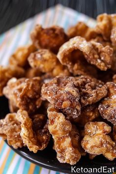 a plate filled with fried food on top of a table