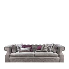 a gray couch with pillows on top of it