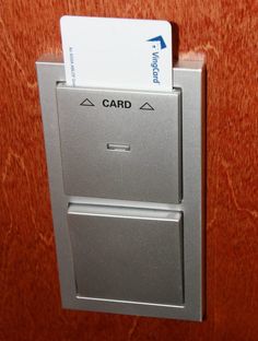 a close up of a metal door with a card on it