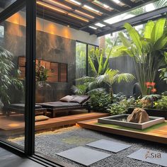 an outdoor living area with plants and rocks