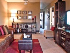 a living room filled with furniture and a flat screen tv