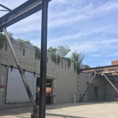 an empty parking lot next to a building