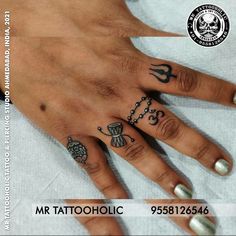 a woman's hand with tattoos on it and the words mr tatooholicc