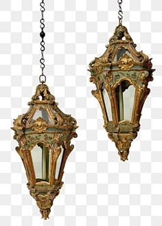 two hanging lights with chains attached to them, one is gold and the other is white