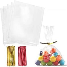 plastic bags filled with different colored balls and straws next to each other on a white background