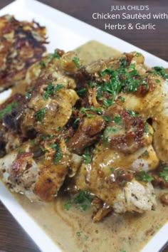 the chicken is covered in sauce and garnished with parsley