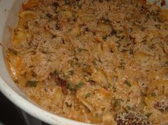 a casserole dish filled with pasta and cheese