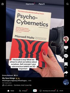 a person holding up a book in front of their face and the text psychic - cybernetics