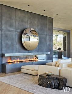 modern living room with fireplace and mirror on the wall