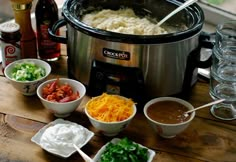 an image of food being cooked in the crock pot with other ingredients around it